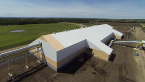 Source Energy Services’ sand storage facility in Alberta, Canada, constructed by Legacy Building Solutions Inc., can receive several unit trains monthly, each usually carrying more than 10,000 tons of material. Photo: Legacy Building Solutions