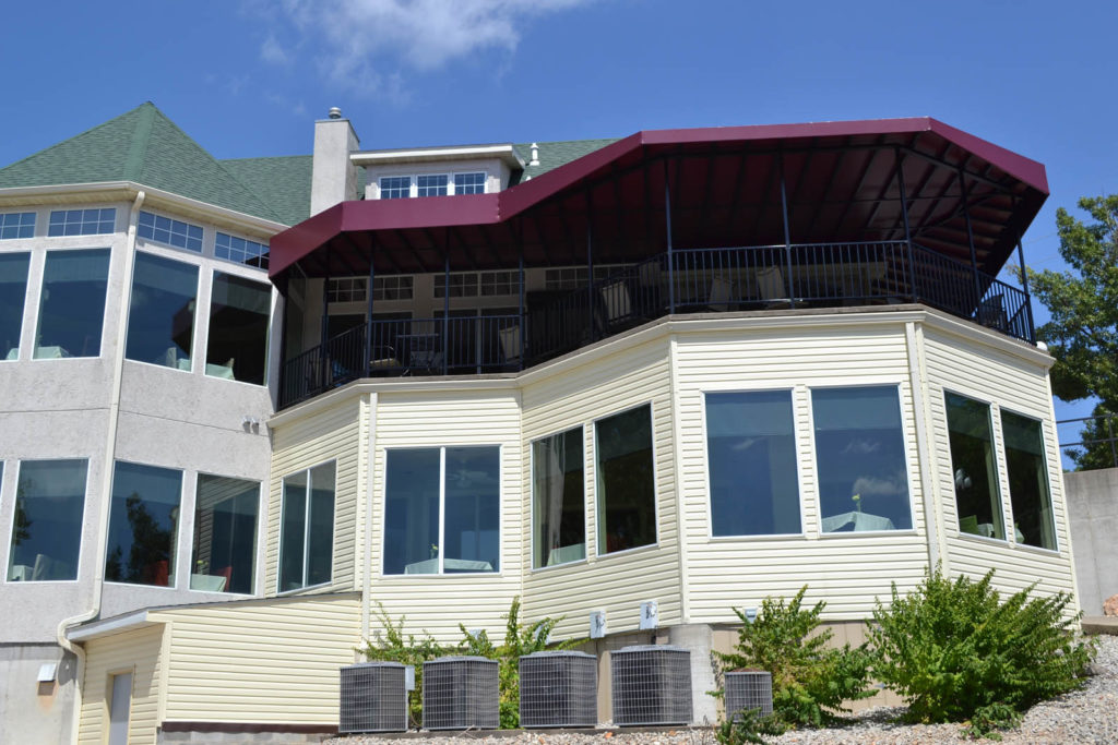 Need weather-resistant metal canopy solutions for coastal restaurant patios