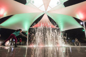Kids check out the new fountains at the Paseo de Luces grand opening event Dec. 12. View photo by David Weibel