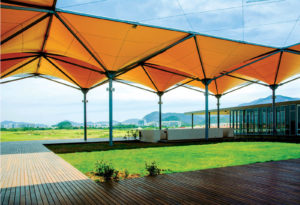 Linked sets of 14 inverted pyramids sheltered a plaza at the Olympic Golf Course in Rio de Janeiro for the 2016 Summer Olympics. The champagne-colored fabric pyramids are designed to collect rainwater that is used to hydrate the grounds and the course. Fabric used is Précontraint 1002 S2 from Serge Ferrari. Photo: Serge Ferrari.