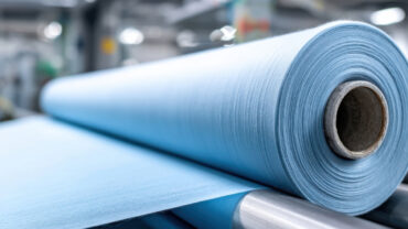 A roll of light blue fabric.