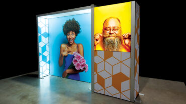 Vibrant display featuring a joyful woman with flowers on a blue background and a smiling man with a beard on a yellow background.